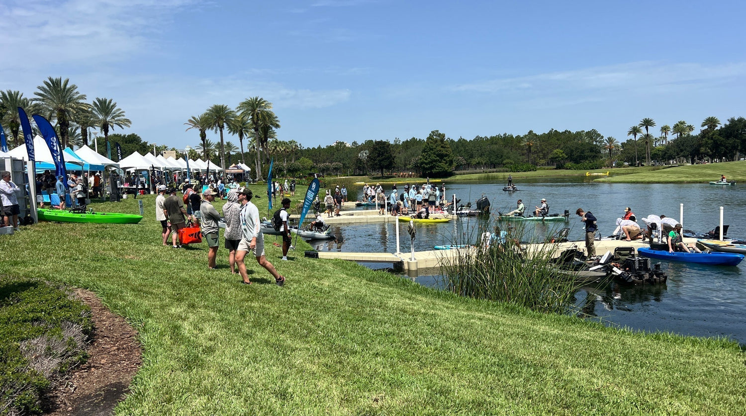 Anglers testing kayaks and gear on the water at iCast 2026 in Orlando