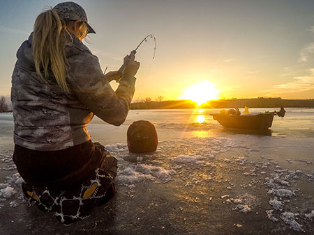 Sunset in front of women fishing.