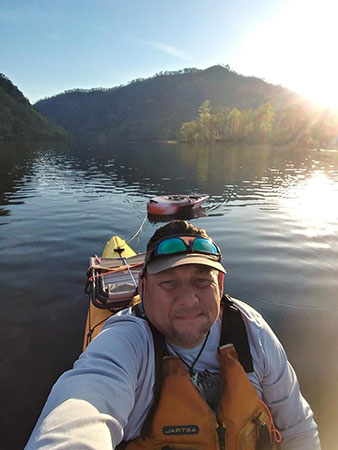 Jackson Kayak Journey sitting in the water.