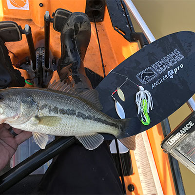 Mike showing off his catch inside the Hobie Pro Angler 14.